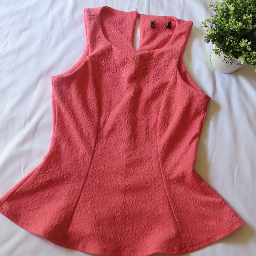 Sleeveless peplum top with stone details